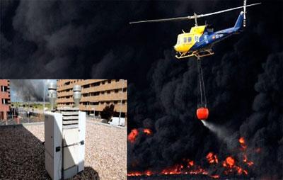 Helicóptero rociando agua sobre incendio